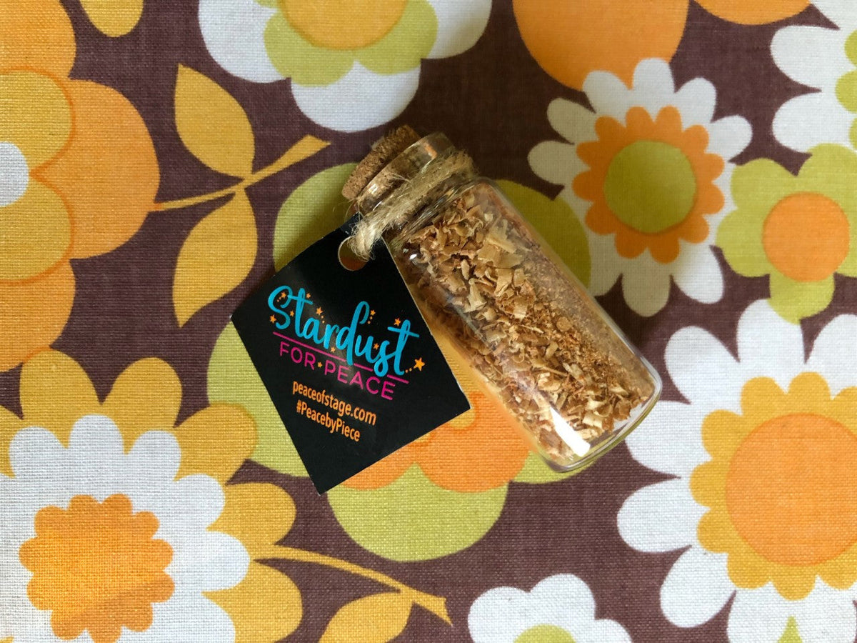 Glass Bottle Filled with shavings and stardust from the original 1969 Woodstock stage wood